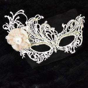 Hand beaded mask with flower accent